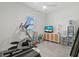 Home gym with exercise equipment, television, and natural light at 271 Monet Trl, Bradenton, FL 34212