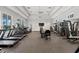 Bright gym equipped with treadmills, ellipticals, and weight machines for a complete workout at 271 Monet Trl, Bradenton, FL 34212