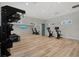 Functional fitness area with weightlifting equipment, cardio machines, and mirrors at 271 Monet Trl, Bradenton, FL 34212