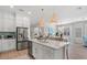 Modern kitchen with white cabinets, stainless steel appliances, and island with seating at 271 Monet Trl, Bradenton, FL 34212