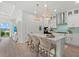 Beautiful kitchen with white cabinets, quartz countertops and island with seating at 271 Monet Trl, Bradenton, FL 34212