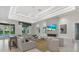 Modern living room with plush couches, contemporary fireplace, and tray ceiling with recessed lighting at 271 Monet Trl, Bradenton, FL 34212