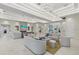 Spacious lounge area with recessed lighting, modern furniture, and views of a pool at 271 Monet Trl, Bradenton, FL 34212