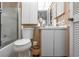 Bathroom with shower, white cabinets, updated fixtures, and a bright interior at 2922 60Th W St, Bradenton, FL 34209
