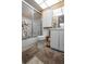 Bathroom with shower, white cabinets, updated fixtures, and a bright interior at 2922 60Th W St, Bradenton, FL 34209