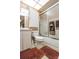 Practical bathroom with white fixtures, a vanity, and a shower/tub combo with sliding glass doors at 2922 60Th W St, Bradenton, FL 34209