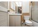 Cozy bathroom featuring a white vanity, toilet, and shower with bright lighting at 2922 60Th W St, Bradenton, FL 34209