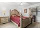Charming bedroom featuring a decorative headboard, classic nightstands, and ample natural light at 2922 60Th W St, Bradenton, FL 34209