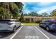 Exterior view of the front of the building with two cars in parking spaces at 2922 60Th W St, Bradenton, FL 34209