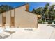 Community pool building with ample room for recreation under a sunny sky and surrounding trees at 2922 60Th W St, Bradenton, FL 34209
