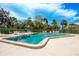 Community pool with ample room for recreation under a sunny sky at 2922 60Th W St, Bradenton, FL 34209