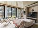 Bright sunroom features neutral decor, large windows, seating and a view to the outdoors at 2922 60Th W St, Bradenton, FL 34209