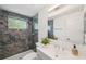 Updated bathroom with tiled shower, modern vanity, and recessed lighting at 3114 59Th S St # 101, Gulfport, FL 33707