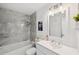 Clean bathroom features a white vanity, marble-look shower, and modern fixtures at 3114 59Th S St # 101, Gulfport, FL 33707