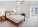 Bright bedroom with white walls and wicker furniture at 3114 59Th S St # 101, Gulfport, FL 33707