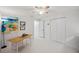 Well-lit bedroom space including a work desk, decorations, and wide closet space at 3114 59Th S St # 101, Gulfport, FL 33707