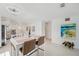 Open dining area with modern table and view of the updated kitchen at 3114 59Th S St # 101, Gulfport, FL 33707