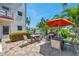 Relaxing outdoor patio area perfect for entertaining with ample seating and barbecue grill at 3114 59Th S St # 101, Gulfport, FL 33707