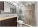 Updated bathroom features a glass-enclosed shower with elegant tile surround at 3206 W Azeele St # 120, Tampa, FL 33609