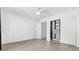 Bright bedroom featuring wood flooring, a ceiling fan, and a closet with sliding doors at 3206 W Azeele St # 120, Tampa, FL 33609