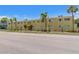 Charming exterior view of the apartments featuring a well-manicured lawn and ample parking at 3206 W Azeele St # 120, Tampa, FL 33609