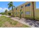 Low-rise building boasting lush tropical landscaping, offering an inviting atmosphere at 3206 W Azeele St # 120, Tampa, FL 33609