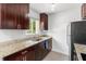 Updated kitchen featuring stainless steel appliances, granite countertops, and ample cabinet space at 3206 W Azeele St # 120, Tampa, FL 33609