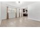 Well-lit living room featuring hardwood floors, a modern light fixture, and two windows at 3206 W Azeele St # 120, Tampa, FL 33609