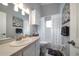 Bright bathroom featuring a shower-tub, vanity with sink, and decorative artwork at 3831 Yardley N Ave, St Petersburg, FL 33713