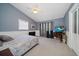 Bedroom featuring vaulted ceiling, neutral carpet, and accent wall at 3831 Yardley N Ave, St Petersburg, FL 33713