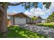 Charming single-story home with a well-manicured lawn and mature trees at 3831 Yardley N Ave, St Petersburg, FL 33713