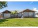 Charming single-story home with a well-manicured lawn and mature trees at 3831 Yardley N Ave, St Petersburg, FL 33713