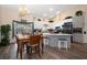 Open concept kitchen with modern appliances and an adjacent dining area at 3831 Yardley N Ave, St Petersburg, FL 33713