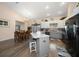 Open concept kitchen with modern appliances and an adjacent dining area at 3831 Yardley N Ave, St Petersburg, FL 33713