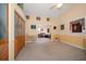 Spacious living room with vaulted ceilings, neutral carpet, and ample lighting at 3831 Yardley N Ave, St Petersburg, FL 33713