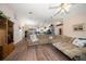 Bright living room showcasing wood flooring, a large sofa, and an open layout at 3831 Yardley N Ave, St Petersburg, FL 33713