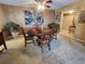 Dining room with wood table, decor, and wall art in a well-lit setting at 400 64Th Ave # 1105, St Pete Beach, FL 33706