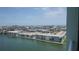 Exterior view featuring buildings alongside a channel of water under a sunny sky at 400 64Th Ave # 1105, St Pete Beach, FL 33706