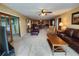 Spacious living room with hardwood floors, ample seating, and tasteful decor at 400 64Th Ave # 1105, St Pete Beach, FL 33706