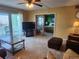 Comfortable living room with balcony access and bedroom views at 400 64Th Ave # 1105, St Pete Beach, FL 33706