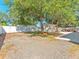 Expansive backyard featuring a white privacy fence, a storage shed, and a lovely gazebo-covered seating area at 4111 Whiting Se Dr, St Petersburg, FL 33705