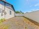 Spacious backyard with white fence at 4111 Whiting Se Dr, St Petersburg, FL 33705