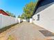 View of the spacious backyard with a white fence at 4111 Whiting Se Dr, St Petersburg, FL 33705