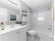 Bright bathroom featuring a shower-tub combination and a white sink at 4111 Whiting Se Dr, St Petersburg, FL 33705