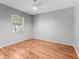 This bedroom has vinyl floors, a ceiling fan and a window at 4111 Whiting Se Dr, St Petersburg, FL 33705