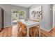 Bright dining area with sliding doors and a modern white table at 4111 Whiting Se Dr, St Petersburg, FL 33705