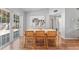Dining room features wood floors, light walls, and a sliding glass door to the outside at 4111 Whiting Se Dr, St Petersburg, FL 33705