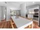 Open-concept living space with dining area, kitchen, and living room at 4111 Whiting Se Dr, St Petersburg, FL 33705