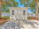 Exterior shot of the storage shed with a concrete patio, perfect for outdoor projects and storing seasonal items at 4111 Whiting Se Dr, St Petersburg, FL 33705
