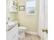 Bright bathroom with updated vanity, granite countertop, and tiled floors at 4211 28Th N Ave, St Petersburg, FL 33713